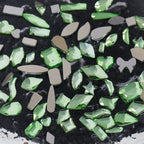 Nail art featuring a mix of unique shapes, flat-bottomed glass rhinestones, ultra-sparkling light green gel nail art, trendy and Instagram-worthy.
