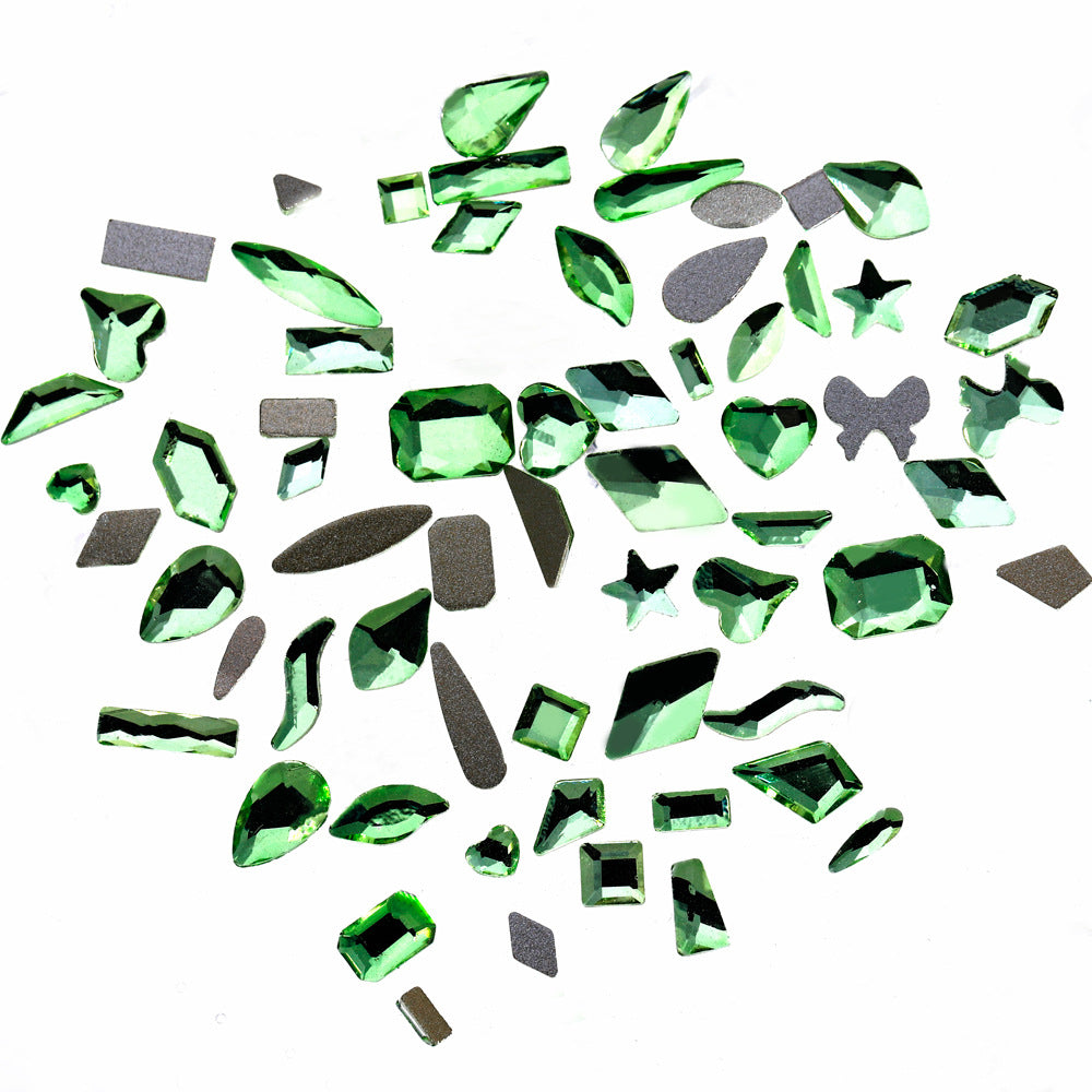Nail art featuring a mix of unique shapes, flat-bottomed glass rhinestones, ultra-sparkling light green gel nail art, trendy and Instagram-worthy.